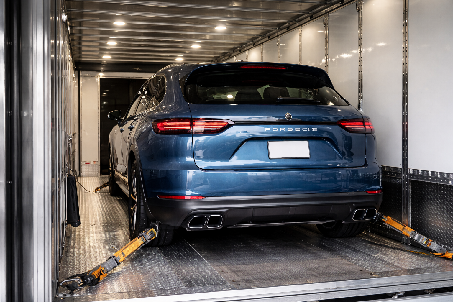 Photo of Porsche SUV inside an Enclosed Auto Transport trailer