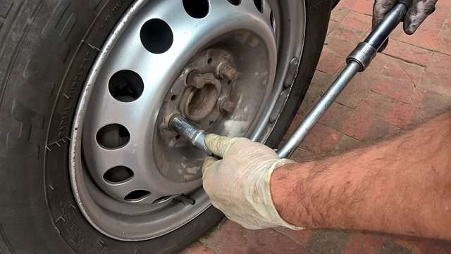 photo of a man Maintain your car change the tires