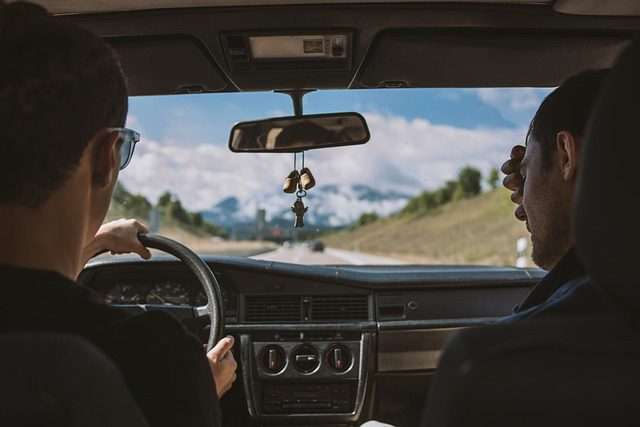 photo of friends driving across country or car shipping